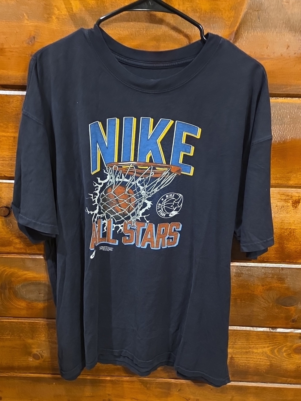 Nike Black Tee with Blue & Yellow Logo and Orange Basketball Graphic